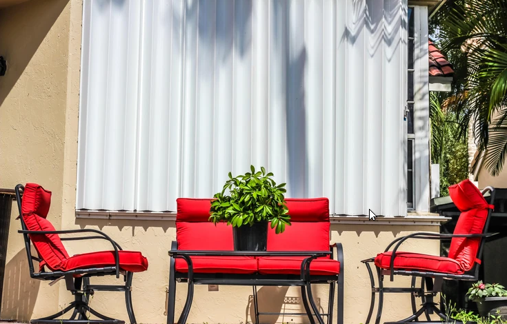 Accordion hurricane shutters for coastal homes